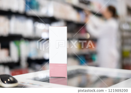 In pharmacy, there is cosmetic product for professional skin care on separate counter. In pharmacy, there is cosmetic product for professional skin care on separate counter. 121989200