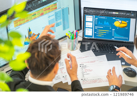 Male engineer business plan analysis graph businessmen 2 people 121989746