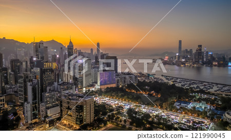 Dec 21 2024 Dusk with Illuminated Skyscrapers and Mountain Backdrop at Causeway Bay Dec 21 2024 Dusk with Illuminated Skyscrapers and Mountain Backdrop at Causeway Bay 121990045