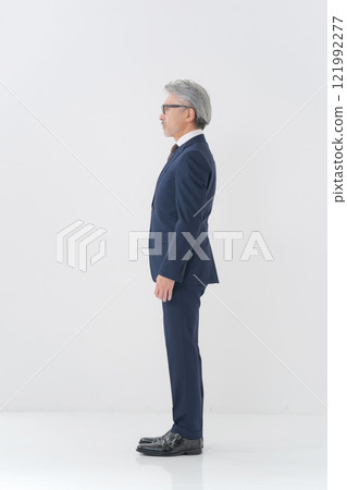 Portrait of a senior man in a suit 121992277