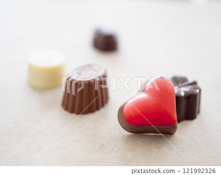 Heart-shaped and other chocolates Heart-shaped and other chocolates 121992326