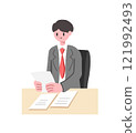 businessman sitting at the table 121992493