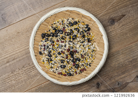 Aerial view of 16-grain rice served in a bamboo basket on a wooden background 121992636