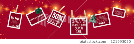 Christmas sale tags hanging on glowing garland Christmas sale tags hanging on glowing garland 121993030