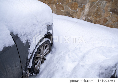 Car Buried in Snowy Landscape Car Buried in Snowy Landscape 121993264