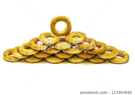 Poppy bagels stacked on top of each other on a white background Poppy bagels stacked on top of each other on a white background 121993686