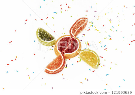 Citrus wedges of marmalade and confectionery on a white background Citrus wedges of marmalade and confectionery on a white background 121993689