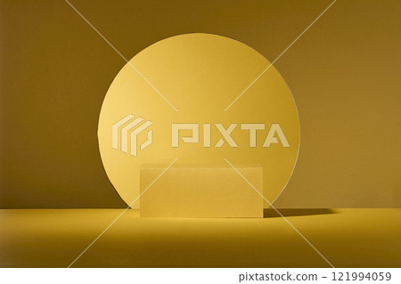 Chinese New Year concept on basic golden backgrounds with a circle-shaped cutout, featuring a close-up of empty yellow rectangular podiums for presentation products, placed in the center. 121994059