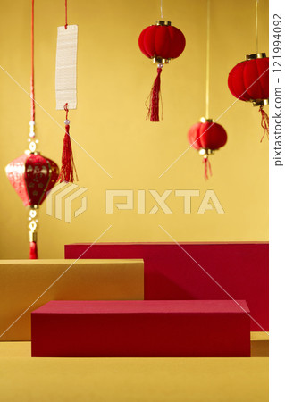 A traditional New Year concept. Several cylindrical pedestals used to display a product in front of a golden background. Decorated with Chinese lanterns and calligraphy. A traditional New Year concept. Several cylindrical pedestals used to display a product in front of a golden background. Decorated with Chinese lanterns and calligraphy. 121994092