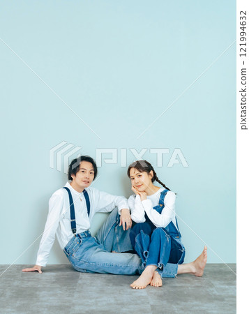 Couple photo of a man and woman wearing denim 121994632