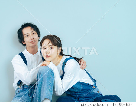 Couple photo of a man and woman wearing denim 121994633