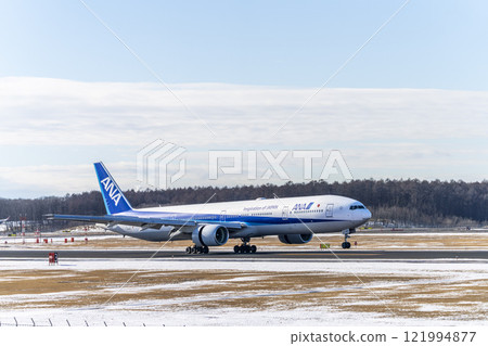 Winter at New Chitose Airport, landing plane, Chitose, Hokkaido Winter at New Chitose Airport, landing plane, Chitose, Hokkaido 121994877