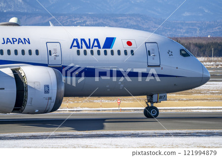 Winter at New Chitose Airport, landing plane, Chitose, Hokkaido 121994879