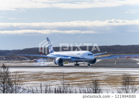Winter at New Chitose Airport, landing plane, Chitose, Hokkaido Winter at New Chitose Airport, landing plane, Chitose, Hokkaido 121994880