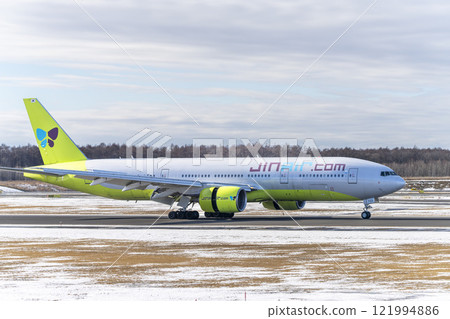 Winter at New Chitose Airport, landing plane, Chitose, Hokkaido Winter at New Chitose Airport, landing plane, Chitose, Hokkaido 121994886