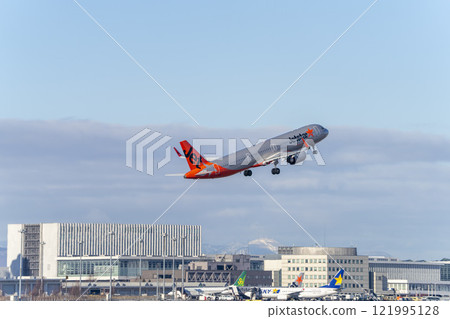 New Chitose Airport in winter, airplane taking off, Chitose, Hokkaido New Chitose Airport in winter, airplane taking off, Chitose, Hokkaido 121995128