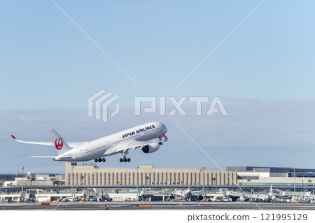 New Chitose Airport in winter, airplane taking off, Chitose, Hokkaido New Chitose Airport in winter, airplane taking off, Chitose, Hokkaido 121995129