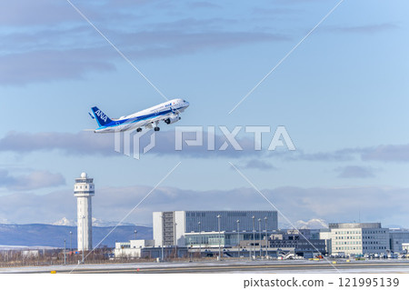 New Chitose Airport in winter, airplane taking off, Chitose, Hokkaido 121995139