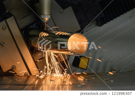 Close up scene the fiber laser cutting machine cut the stainless steel tube and sparkling light. Close up scene the fiber laser cutting machine cut the stainless steel tube and sparkling light. 121996307