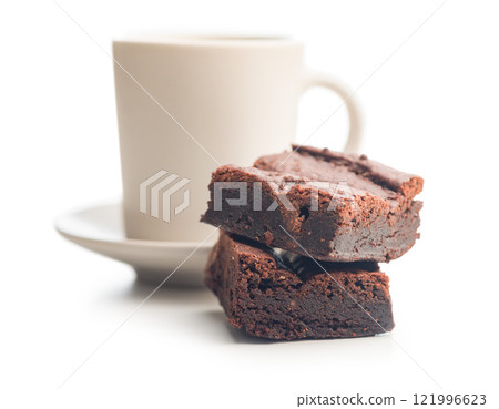 Homemade chocolate brownies and coffee cup isolated on white background. Homemade chocolate brownies and coffee cup isolated on white background. 121996623