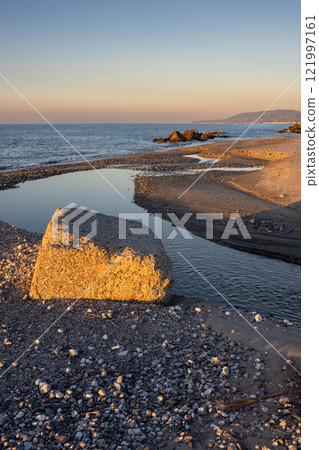 Beach with a small river, Spadafora, Sicily, Italy Beach with a small river, Spadafora, Sicily, Italy 121997161