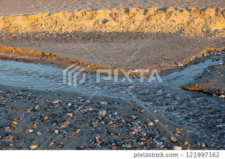 Detail of a beach with small river, Spadafora, Sicily, Italy 121997162