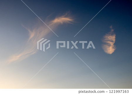 Feather clouds on the sunset sky, Spadafora, Sicily, Italy Feather clouds on the sunset sky, Spadafora, Sicily, Italy 121997163