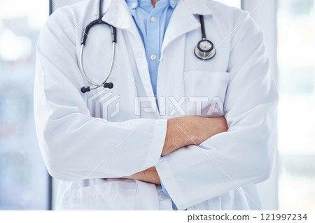 Closeup, man and doctor with arms crossed, healthcare and leadership in hospital. Male, surgeon and medical professional with confidence, leader and ready for surgery procedure, medicine and wellness Closeup, man and doctor with arms crossed, healthcare and leadership in hospital. Male, surgeon and medical professional with confidence, leader and ready for surgery procedure, medicine and wellness 121997234