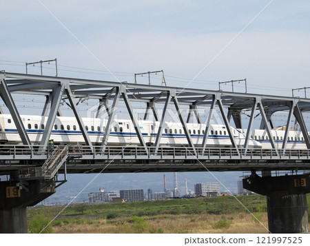 Shinkansen passing by the Fuji River 121997525