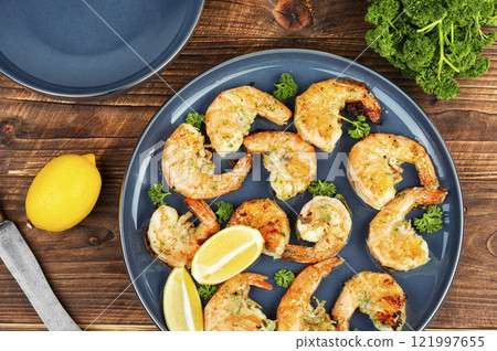 A plate of grilled giant prawns. 121997655