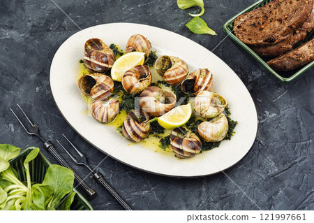 Baked snails with butter. 121997661