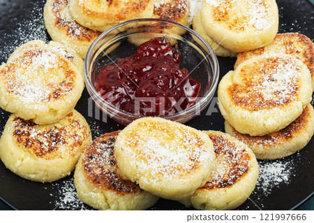 Tasty cottage cheese pancakes, Syrniki. 121997666