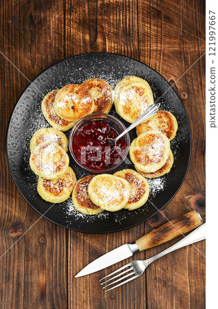 Homemade cottage cheese pancakes syrniki. Homemade cottage cheese pancakes syrniki. 121997667