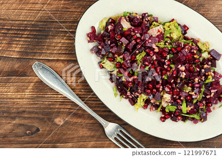 Vegan beetroot and pomegranate salad. 121997671