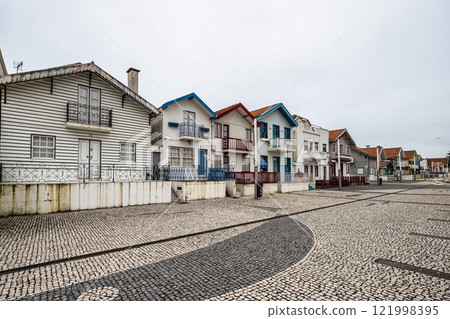 Street with colorful houses. Street with striped houses, Costa Nova, Aveiro, Portugal 121998395
