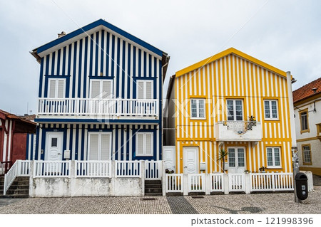 Street with colorful houses. Street with striped houses, Costa Nova, Aveiro, Portugal Street with colorful houses. Street with striped houses, Costa Nova, Aveiro, Portugal 121998396