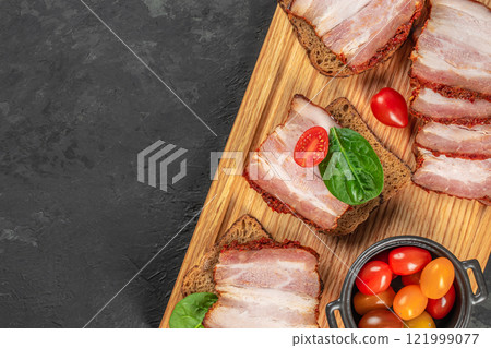 sandwich with pork ham on a wooden board, top view. copy space sandwich with pork ham on a wooden board, top view. copy space 121999077
