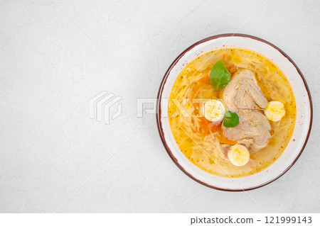 Quail broth or soup in a bowl on a white background top view. copy space Quail broth or soup in a bowl on a white background top view. copy space 121999143