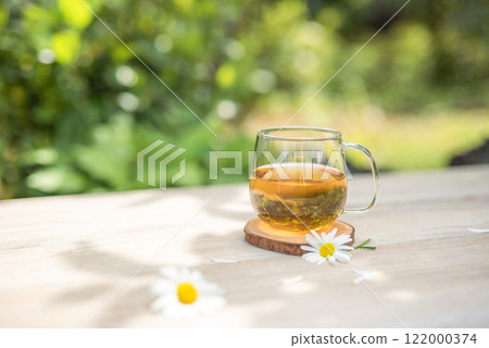 Tea time in the spring sunshine 122000374