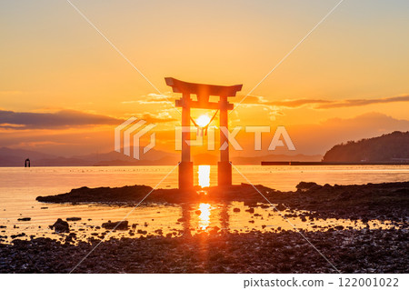 Torii gate and sunset at Nagao Tsurugi Shrine in winter, at low tide, Uki City, Kumamoto Prefecture 122001022