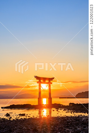 Torii gate and sunset at Nagao Tsurugi Shrine in winter, at low tide, Uki City, Kumamoto Prefecture 122001023