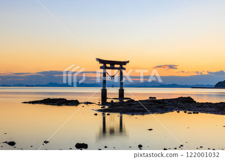 Torii gate of Nagao Tsurugi Shrine after sunset in winter at low tide, Uki City, Kumamoto Prefecture 122001032