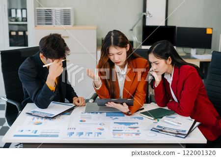 Businessman team working are under stress from financial data and report graph. 122001320