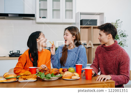 drinks and conversation, social gathering and get together. lifestyle young people, happy and celebrate with food at home. 122001351