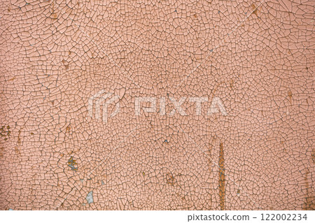 Peeling paint on the wall. Panorama of a concrete wall with old cracked flaking paint. Weathered rough painted surface with patterns of cracks and peeling. Peeling paint on the wall. Panorama of a concrete wall with old cracked flaking paint. Weathered rough painted surface with patterns of cracks and peeling. 122002234