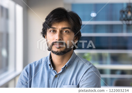 Positive serious Indian business leader man posing for portrait Positive serious Indian business leader man posing for portrait 122003234