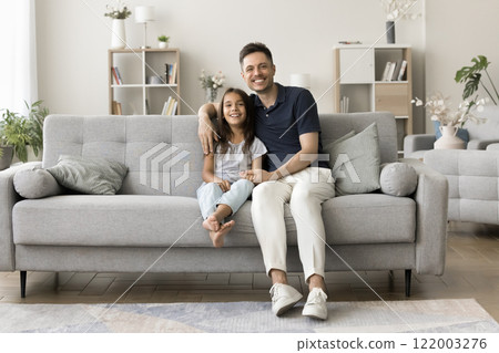 Portrait of smiling loving daddy embracing small preschooler daughter Portrait of smiling loving daddy embracing small preschooler daughter 122003276