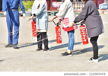 People conducting firefighting training, firefighting training, disaster prevention training, people holding fire extinguishers, image material 122003458