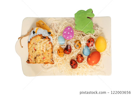 Easter cake, cookies and painted eggs in ceramic tray. Isolate on a white background. Easter traditions. Variety of homemade foods. Country style. Easter cake, cookies and painted eggs in ceramic tray. Isolate on a white background. Easter traditions. Variety of homemade foods. Country style. 122003656