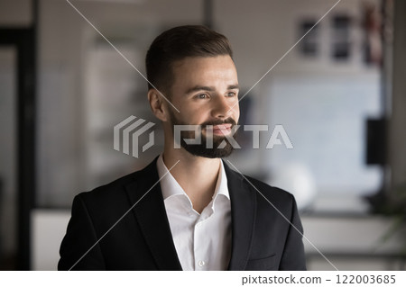 Pensive businessman dressed in formal jacket gazing into distance Pensive businessman dressed in formal jacket gazing into distance 122003685